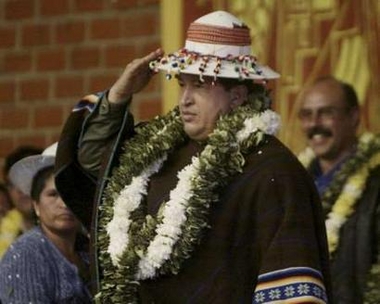Hugo Chavez salutes the Bolivian hat